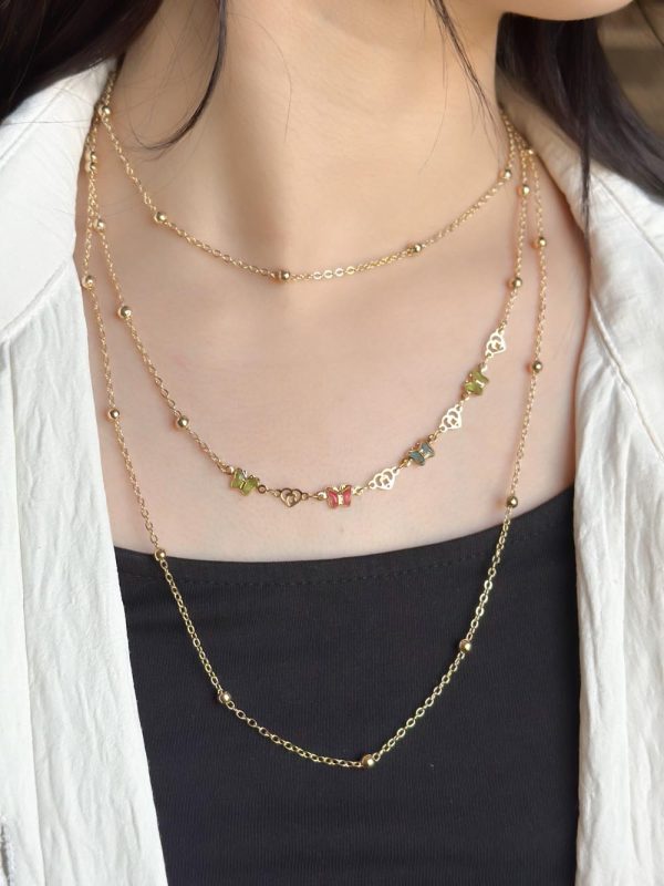 Collier fantaisie à trois chaînes avec papillons P011119